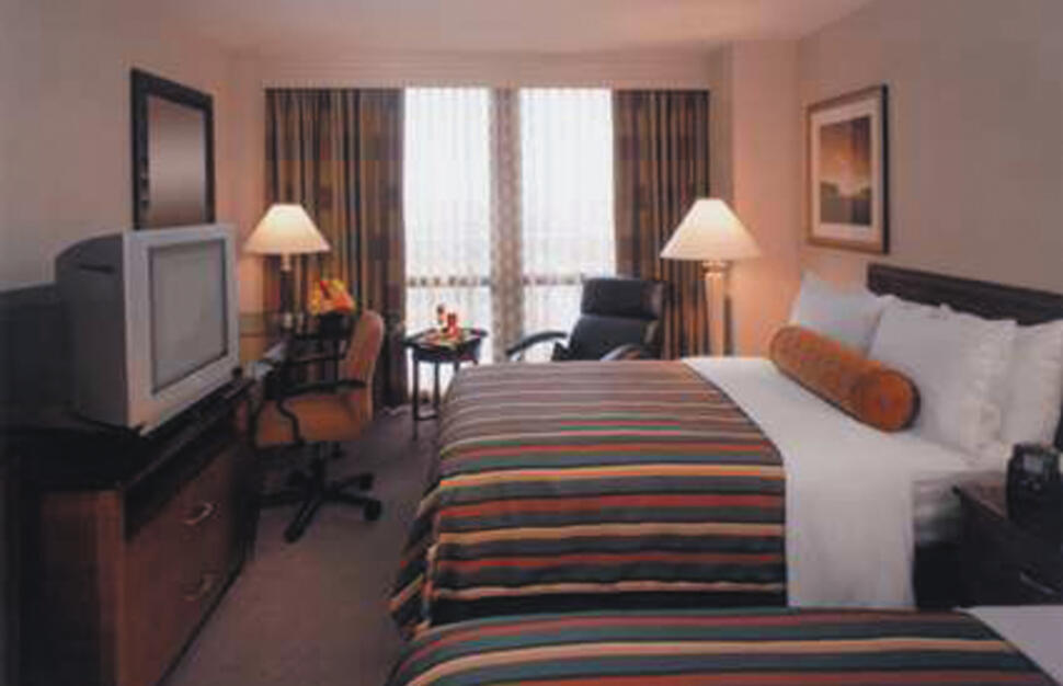 Bedroom at the Hilton Chicago O'Hare Hotel, USA.