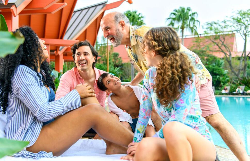 Family beside the quieter pool