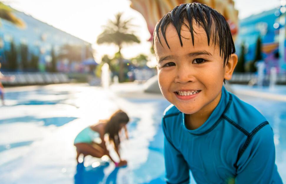 Little boy by the pool at Disney's Art of Animation Resort