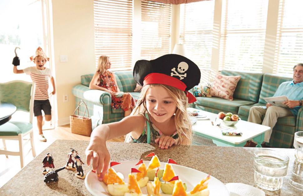 Family in villa living room